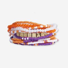 Show your team spirit with our curated Game Day bracelet stack. It features 10 strands of seed bead bracelets and a brass friendship bracelet sporting the word "GAMEDAY". Stack Game, Halloween Beads, Bead Bracelets, Seed Bead Bracelets, Purple Orange, Bracelet Stack, Team Spirit, Friendship Bracelet, Seed Bead