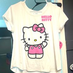 Super Cute And Super Soft Hello Kitty Tee Size Small New With Tags White Kawaii Crew Neck Top, Hello Kitty Crew Neck Fun Tops, Hello Kitty Short Sleeve Top, Fun White Top With Cartoon Print, White Fun Tops With Cartoon Print, Fun White Tops With Cartoon Print, White Top With Cartoon Print, Hello Kitty Fun Crew Neck Top, Hello Kitty Crew Neck Top