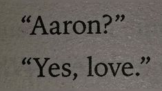 the words aaron? yes, love written in black ink on a gray t - shirt