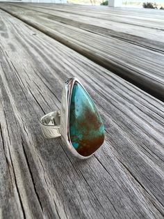 Teardrop shaped turquoise bezel set in sterling silver. Sterling tapered band.  Ring size 8 Adjustable Teardrop Jewelry With Polished Finish, Sterling Silver Teardrop Rings, Turquoise Teardrop Gemstone Rings, Unique Turquoise Teardrop Rings, Unique Teardrop Turquoise Rings, Adjustable Teardrop Turquoise Ring, Teardrop Turquoise Sterling Silver Rings, Unique Adjustable Teardrop Turquoise Ring, Unique Adjustable Turquoise Teardrop Ring