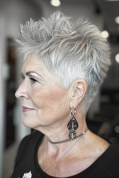 A woman with a silver pixie haircut featuring a spiky top for an edgy, playful look Short Spiky Haircuts For Women Over 50, Edgy Short Hair For Women Over 50, Spiky Pixie Haircut, Grey Hair Wax, Short Hair Back, Short White Hair