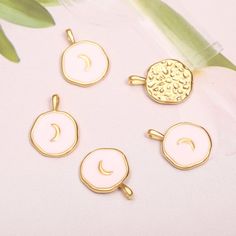 4Pcs Whiter Enamel Moon Pendant,18k Gold Plated Crescent Moon Charm,Round Gold Moon Medallin Pendants For Necklace,Celestial JewelryMaterial:18K Gold PlatedTheme:MoonShape: Moon Medallion PendantSize :17x13mmHole size:3mmColour :GoldQuantity :4PcsPendant weighs:16g/4pcsItem No.: AWW-P1217Note:Actual colors of any item or chains may slightly differ from screen to screen due to the screen resolution. We take our pictures in natural light during the day.If you have any questions or want a custom or Pink Round Moon Charm Jewelry, Pink Moon Charm Jewelry, Pink Moon-shaped Jewelry With Moon Charm, Pendants Necklace, Starfish Pendant, Gold Moon, Celestial Jewelry, Moon Shapes, Moon Charm