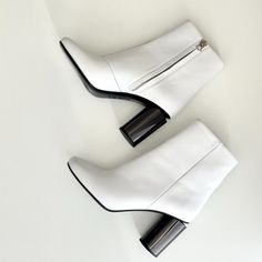 Acne Studios White Leather Cutout Heel Ankle Boots! Description: Just A Minimal Chic Ankle Boot By Acne Studios! So Versatile Day Or Night; With Denim, Mini Skirt Or Favorite Dress Size: 38 (Us 8) Color: White Condition: Excellent Condition. Guaranteed Authentic. Without Original Box Details: Supple White Leather, Side Zip Closure W/Silvertone Hardware, Semi-Rounded Toe, Nude Leather Lining W/White Fabric Stitched Logo, Tonal Stitching Design, Back Cutout Round Chunky Mirrored Heels, Approx. 3" To Cutout, Leather Soles W/Designer Logo. Note: Minor Nick On Left Front Vamp, Couple Marks On Inner Left Back Heel, Minor Marks On Right Inner Boot. Overall Beautiful!! Made In Italy Not Acne Studios Shoes, Cutout Heels, Minimal Chic, Heeled Ankle Boots, Favorite Dress, White Fabrics, White Leather, Acne Studios, Bootie Boots