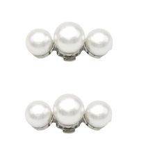 three white pearls on a white background