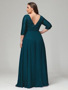 a woman in a long green dress with an open back and lace detailing on the shoulders