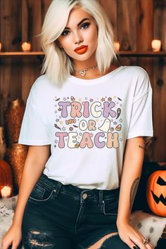 a woman with blonde hair wearing a trick or treat t - shirt