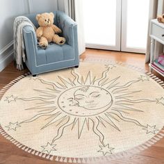 a child's room with a teddy bear sitting on a chair in front of a sun and moon rug