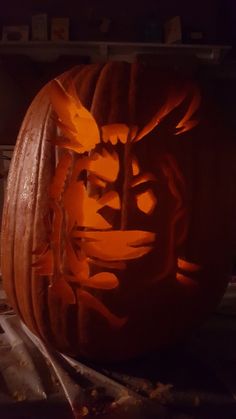 a carved pumpkin with an image of a man's face on it