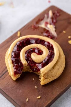 a peanut butter and jelly cookie on a cutting board