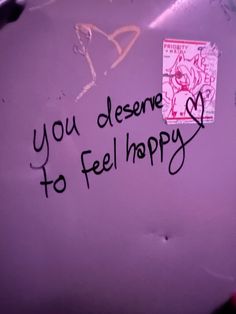 graffiti written on the side of a purple wall with writing that says, you deserves to feel happy