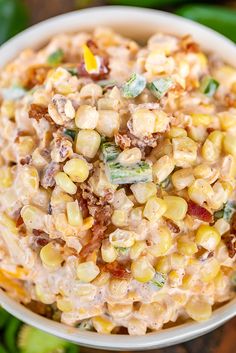 corn salad in a bowl with text overlay that reads jalapeno popper corn salad