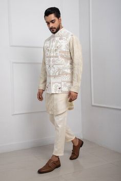 Ivory Nehru jacket embroidered with shimmer thread and beads in floral and bird motif. - Aza Fashions White Bandhgala For Spring Designer Wear, Cream Nehru Jacket With Chikankari Embroidery For Reception, Off White Nehru Jacket For Eid Reception, White Sherwani With Zari Work For Spring, Spring Reception Bandhgala With Zari Work, Traditional Nehru Jacket For Spring Reception, Traditional Nehru Jacket For Reception In Spring, Off White Nehru Jacket With Resham Embroidery For Reception, Spring Embroidered Nehru Jacket For Reception