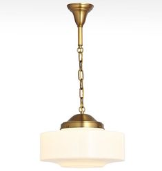 a light fixture with a white shade hanging from the ceiling