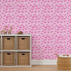 pink leopard print wallpaper in the corner of a room with wicker storage baskets