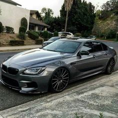 a silver car parked on the side of a road