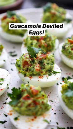 deviled eggs topped with guacamole and garnish