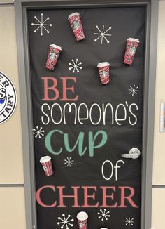 a door decorated with cups and snowflakes that says be someone's cup of cheer