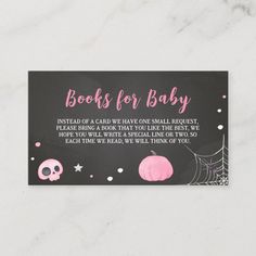 a black and pink book for baby card with skulls, pumpkins and spider web