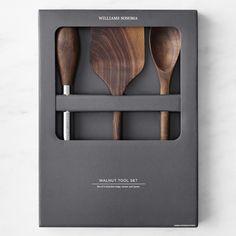 three wooden utensils in a black box on a white table top with the words walnut tools set