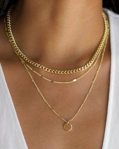 Layering made easy with this set of necklaces. 3 different chains with varying lengths connected to 1 lobster clasp and extender chain. Content: - Gold Plated - Length is Adjustable Size: - Thick Chain: 14” - Dainty Thin Chain: 15" - Chain with Disc: 18" -Disc Size: 0.4" diameter Materials + Care: -Chains are made from PLATED GOLD -All jewelry has a coat to help from tarnishing; however, to further help preserve jewelry, please avoid water, lotion, and other liquids when wearing. Thick Gold Chain Necklace, Gold Boho Necklace, Jewellery Logo, 3 Layer Necklace, Jewellery Organizer, Thick Gold Chain, Gold Disc Necklace, Thick Chain Necklace