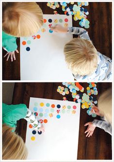 two children are playing with paper and confetti