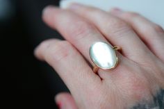 Mother of Pearl set in 14k gold-filled. High polish finish. Available in any size. Listing for matching thick gold-filled stacking ring: https://www.etsy.com/listing/1028176938/thick-gold-stacking-ring-gold-filled?ref=shop_home_active_16&frs=1 PLEASE USE A POLISHING CLOTH TO CLEAN UP ANY TARNISH THAT WILL NATURALLY HAPPEN. We offer polishing/refurbishing. Here's the listing: https://www.etsy.com/listing/960628506/jewelry-repairs-clean-and-polishing?ref=shop_home_active_43&frs=1 Classic Mother Of Pearl Ring As A Gift, Classic Mother Of Pearl Ring As Gift, Classic Mother Of Pearl Ring For Gift, 14k Gold Moonstone Ring With Polished Finish For Wedding, 14k Gold Polished Moonstone Wedding Ring, 14k Gold Moonstone Ring For Wedding, Classic Mother Of Pearl Rings As A Gift, Classic Mother Of Pearl Rings As Gift, Gold Mother Of Pearl Ring As A Gift