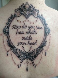 the back of a woman's neck with a quote on it that reads, how do you run from whats inside your head?