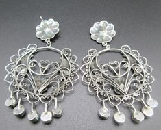 "DESCRIPTION: Even though these are considered a Oaxaca \"Wedding\" earring,wedding bells don't have to be ringing for you to wear these very feminine style earrings! You can wear these on your special day or make any day special with these Doves are praised in Oaxaca & it's where the dove is highly admired & always seems to gives off a feminine feeling of serenity, when worn..They have a wonderful Mexican Folk Art sophistication...Wear these with any Mexican textile wardrobe to your fav Artisan Stamped 925 Jewelry For Wedding, Artisan Wedding Jewelry Stamped 925, Hallmarked Bohemian Earrings For Wedding, Oaxaca Wedding, Mexican Textiles, Wedding Earring, Earring Wedding, The Dove, Santa Fe Nm