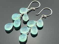 Genuine Aqua Blue Chalcedony Faceted Drops  Swan style earwires Earrings are 55 mm (2 1/4 inches) long.  Stones measure 12 mm x 8 mm. All components are 925 Sterling Silver. Weight : 34 Ct Earrings come with a free gift box. Earrings can be made in 14K Gold Filled also. IMPORTANT! ORDERS ARE NO LONGER SHIPPED TO GERMANYPlease read the description carefully, and check all the measurements before placing an order so the item received will not be bigger, smaller, shorter, or longer than expected. P Gold Filled Earrings, Blue Chalcedony, Earring Gifts, Aqua Blue, Free Gift, Jewelry Earrings Dangle, Gold Filled, Dangle Earrings, Etsy Accessories