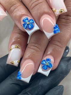 3d flower, white airbrush, charms and bling, gold nails 💫💫 Blue And Gold Square Nails, 3d Nail Designs Flowers Short Nails, Nails W 3d Flowers, Blue And Yellow Flower Nails, 3d Flower Nails Blue, Square Nail Designs Blue, Blue 3d Flower Nails, Blue And Yellow Nails Designs, Blue And Gold Nail Designs