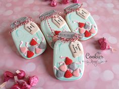 cookies decorated with hearts are on a table