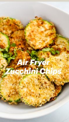 fried zucchini chips in a white bowl with the words air fryer zucchini chips