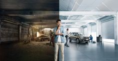 a man standing in an empty garage next to two parked cars and people looking at them