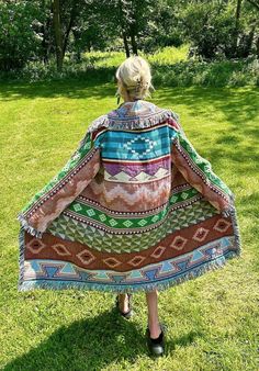 Introducing my latest creation! Upcycled a gorgeous western blanket into this cozy, one of a kind tapestry cardigan. Perfect for breezy seaside mornings, late nights at festivals, campfires or lounging around the house. Measurements: Chest: 54" Overall length: 43" Sleeve length: 22" Unisex design. Model is 5'10 for reference. Machine washable, tumble dry on low heat. This statement jacket was made with all of my heart, for any human, anywhere, that may be attracted to its vibe! My intention is that the piece will amplify the divine nature of your inner being. ✨🌙 Western Blanket, House Measurements, Western Blankets, Inner Being, Blanket Cardigan, Statement Jacket, Divine Nature, The Divine, Design Model