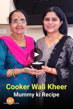 two women standing next to each other holding a bowl