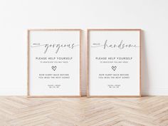 two framed wedding signs on the wall next to a chevron wood floor with a herringbone pattern