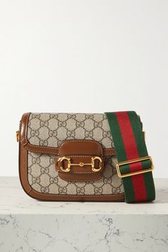 Shop GUCCI Horsebit 1955 mini leather-trimmed printed coated-canvas shoulder bag, Explore the latest GUCCI women's collection today on NET A PORTER Gucci Horsebit Bag, Crossbody Designer Bag, Gucci Crossbody, Gucci Horsebit, Women's Bags By Style, Trendy Handbags, Shoulder Bags For Women, Gucci Shoulder Bag, Olive Leaf