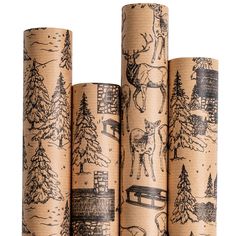 three rolls of christmas wrapping paper with trees and deers on them, all printed in black ink