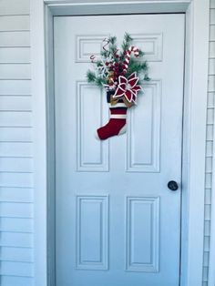 a christmas stocking hanging on the front door