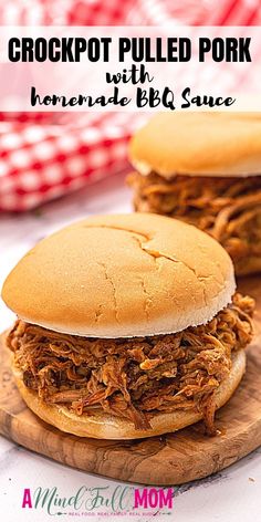 crockpot pulled pork sandwich with homemade bbq sauce on a wooden cutting board