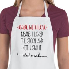 a woman wearing an apron that reads made with love means i looked the spoon and kept using it