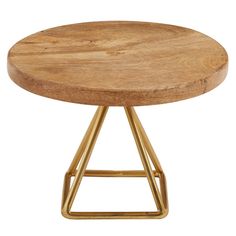 a round wooden table with gold metal legs