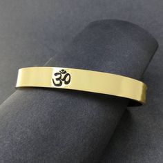 "About item Item :-Kriya Bangles Kada Ring size :- Chose from variation (Custom size accepted) Material  :- 925 Sterling Silver, Brass, Copper Title:-Shiva Om Copper cuff Bracelet, Mantra Bracelet \"Aum \"Open Face Cuff Bangle, Pure Copper Sacred Bracelets for Spiritual Bliss, Yoga Gifts, God Shiva bangles, Om Spiritual Jewelry, Valentine's day gift, Christmas day gift Description:- We accept all types of custom & personalized order. Please send us a message if you are interested in a custom creation. What are the benefits of three metal bangle? Brass, Copper And Silver-3 Metal Bangle With 99.9% Purity The energies of Brass, silver, and copper work synergistically to align your chakras, strengthen your aura, and create a harmonious balance within. In metallurgy, this three-metal bangle is Luxury Spiritual Bangle As A Gift, Symbolic Bangle Bracelet For Meditation, Adjustable Symbolic Cuff Bangle Bracelet, Symbolic Gold Bracelets For Festivals, Adjustable Symbolic Cuff Bracelet, Gold Adjustable Spiritual Wristband, Adjustable Gold Spiritual Wristband, Spiritual Bangle Cuff Bracelet Gift, Spiritual Cuff Bracelet Bangle Gift