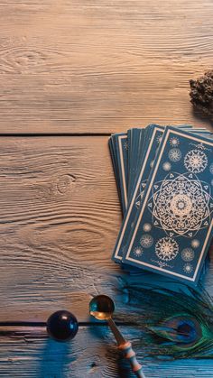 a table topped with cards and spoons on top of a wooden floor covered in snowflakes