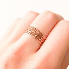 * For your comfort we recommend going up 1/2 size if you are planning on wearing 5 or more rings on one finger. * Set of 5 14K rose gold filled stackable rings. * Made out of 14K rose gold filled 18 gauge round wire (approx. 1 mm wide before texturing). * Our jewelry is packaged in a cute box ready for gift giving. You can also request a personal message which we hand write onto a gift tag. We try to package responsibly in an effort not to waste. Often more than one item with be placed in the sa 14k Rose Gold Stackable Rings, Rose Gold Stackable Midi Promise Rings, Hypoallergenic Rose Gold 14k Stackable Rings, Hypoallergenic 14k Rose Gold Stackable Rings, Delicate Rose Gold Stackable Rings With Round Band, Adjustable 14k Rose Gold Stackable Rings, 14k Rose Gold Midi Promise Ring, Rose Gold 14k Midi Promise Ring, Delicate Rose Gold Stackable Promise Rings