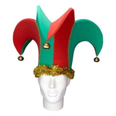 a white mannequin head wearing a red, green and gold jester's hat