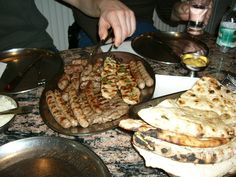 several plates of food on a table at a restaurant