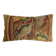 a decorative pillow with two birds on it