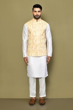 Yellow sleeveless bundi with geometric print and stitchline thread embroidery. Paired with white full sleeve kurta and pant. - Aza Fashions Full Sleeve Kurta, Nehru Jacket, Thread Embroidery, Mandarin Collar, Aza Fashion, Full Sleeve, Geometric Print, Cotton Blend, Thread