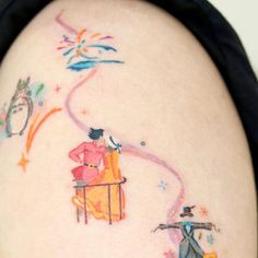 the back of a woman's thigh with an image of two cartoon characters on it